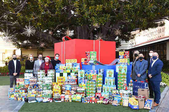 Miramar Hotel officials and their partners with holiday donations